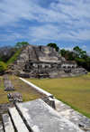 Altun Ha Maya city, Belize District, Belize: Temple of the Masonry Altars, dedicated to the Sun God, Kinich Ahau, patron God of Uxmal and father of Itzamna, lord of night and day - Plaza B - seen from structure A-4 - photo by M.Torres