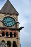 Toronto, Ontario, Canada: clock tower with gargoyle - Old City Hall - Romanesque Revival building designed by E.J. Lennox - Ontario Court of Justice - corner of Queen and Bay Streets - photo by M.Torres