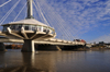 Winnipeg, Manitoba, Canada: Esplanade Riel bridge - side-spar cable-stayed bridge - Provencher Bridge in the background - the Forks - Red River, near the confluence with the Assiniboine River - photo by M.Torres