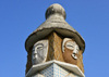 Brazzaville, Congo: totem-like fountain at the center of the 'masks round-about' seen against blue sky - intersection of Avenue de l'Amiti and Boulevard Denis Sassou Nguesso - Rond-point 'aux masques' - homage to Congo's traditional arts - photo by M.Torres