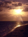 Cook Islands - Rarotonga island: sunset on the water - photo by B.Goode