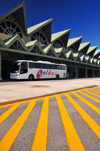 El Catey, Saman province, Dominican republic: landside view of Saman El Catey International Airport / Presidente Juan Bosch - AZS - pointed roofs, tour bus and yellow lines - photo by M.Torres