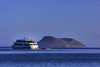 Galapagos Islands - Isla Tortuga: vessel and volcano - only the upper ring of the crater breaches the surface of the Pacific ocean - photo by R.Eime