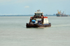 Banjul, The Gambia: ferry to Barra, with Banjul port in the background - Joh - photo by M.Torres