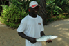 Rubane Island, Bijags Archipelago - UNESCO biosphere reserve, Bubaque sector, Bolama region, Guinea Bissau / Guin Bissau: Hotel Punta Anchaca - an employee displays a freshly caught fish / Hotel Punta Anchaca, empregado a mostrar o peixe pescado - photo by R.V.Lopes