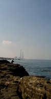 Israel - Qesarriya / Caesarea Maritima / Caesarea Palaestina - Hadera: angler and the Orot Rabin power station - photo by Efi Keren