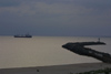 Latvia - Ventspils: sea bound - ship leaves the port - pier and lighthouse (photo by A.Dnieprowsky)