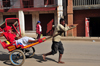 Moramanga, Alaotra-Mangoro, Toamasina Province, Madagascar: Malagasy lady speaking on a cell phone while on a rickshaw -  human-powered transport - pousse-pousse - photo by M.Torres