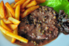 Antananarivo / Tananarive / Tana - Analamanga region, Madagascar: zbu steak au poivre with French fries and lettuce - Malagasy cuisine - photo by M.Torres