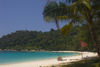 Perhentian Island, Terengganu, Malaysia: Perhentian Island Resort - Teluk Pauh - PIR- two people on white sandy beach lined by vegetation - photo by S.Egeberg