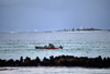 Mozambique island / ilha de Moambique: view of Goa island and passing fishing boat / ilha de Goa e pescadores - photo by F.Rigaud