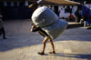 Kathmandu, Nepal: Kuli with a heavy load - photo by W.Allgwer