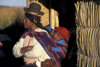 Puno, Peru: Aymara mother and child in the outskirts of town - photo by C.Lovell