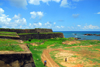 Galle, Southern Province, Sri Lanka: Aeolus bastion from Star Bastion - grey granite rock that came to Galle as ballast - walls and the Indian Ocean - Galle Fort, the Old Town - UNESCO World Heritage Site - photo by M.Torres