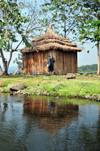 Jinja, Uganda: source of the Nile river at Lake Victoria, Napoleon gulf - wooden hut on Ripon Falls island, the falls themselves disappeared with the construction of Owen Falls Dam - photo by M.Torres