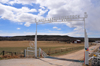 Highway 93, northwest of Douglas, Wyoming, USA: Fetterman Ranch - White Land and Livestock - typical ranch entrance with a metal frame - photo by M.Torres