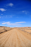 Chaco Canyon National Historical Park, New Mexico, USA: red dirt road and blue sky - photo by M.Torres