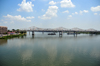 Jeffersonville, Clark County, Indiana, USA: Ohio river and the John F. Kennedy Memorial Bridge single-deck cantilever bridge that carries Interstate 65 - in the background the Big Four pedestrian and bicycle bridge, a former railroad bridge - photo by M.Torres