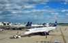 Philadelphia, Pennsylvania, USA: Philadelphia International Airport ground operations - an US Airways Embraer ERJ-190 regional jet aircraft is pushed back from the gate by a pushback tractor / tug - photo by M.Torres