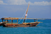 Stone Town, Zanzibar, Tanzania: Nakupenda Isles Safari - Dhow 'Salama' flying the Sardinian flag - Shangani - photo by M.Torres